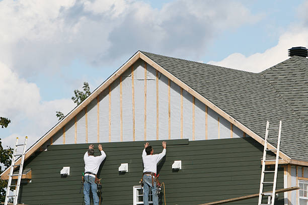 Professional Vinyl Siding technician working in Melville, NY